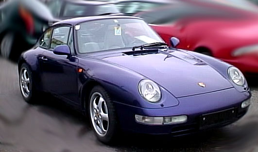 Purple Porsche 993 Carrera coupe viewed from the front left