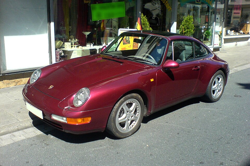 Burgundy Porsche 993 Targa viewed from the front left