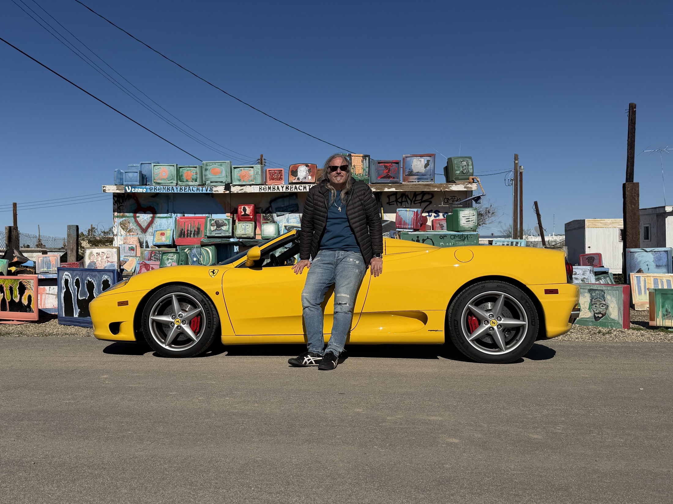 Darin Principe beside a yellow Ferrari 360 Spider