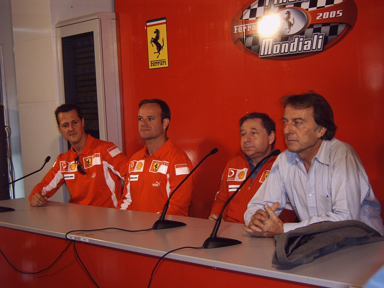 Michael Schumacher, Rubens Barrichello, Jean Todt and Luca di Montezemolo at a Ferrari press conference in 2005.