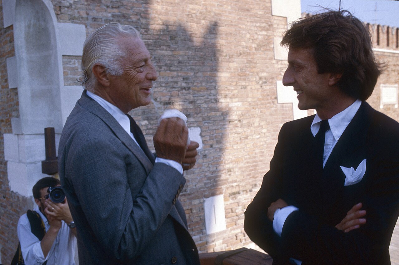 Gianni Agnelli and Luca di Montezemolo talking at the launch of Azzurra in 1985.